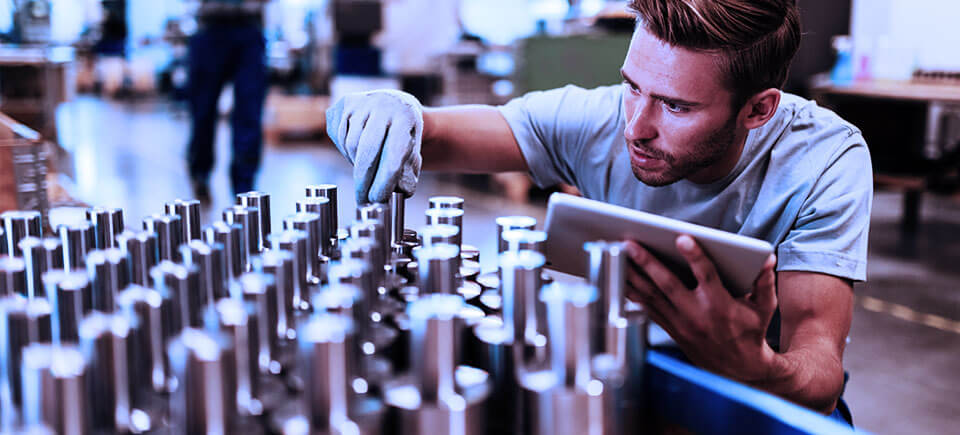 Technician performing quality inspection to ensure product accuracy and compliance at Piedmont Warehousing